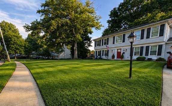Crisp striped lawn in front of a colonial home